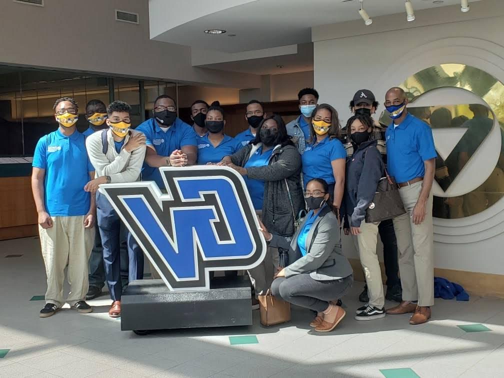 Fort Valley Students and Staff Pose with the GVSU Logo